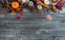 Autumn Background Of Acorns, Corn, Fall Leaves, Fruit And Gourds For The Harvest