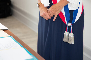 Wall Mural - French woman mayor with scarf france flag tricolor during official celebration in city hall town