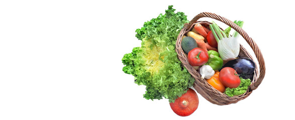 Wall Mural - view above a basket full of fresh and varied vegetables isolated on white panoramic background