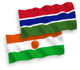 National vector fabric wave flags of Republic of the Niger and Republic of Gambia isolated on white background. 1 to 2 proportion.