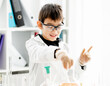 © tan4ikk - School boy in chemistry class
