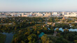 Winding river in the city park. City park at dawn. Aerial photography.