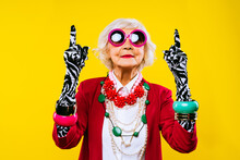 Cool And Stylish Senior Old Woman With Fashionable Clothes - Funny Colorful Portrait Of Elderly Female Lady On Colored Background