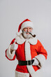 © oneinchpunch - Santa Claus portrait, Christmas and new year's eve festive days concepts - December festive holidays, senior man with beard wearing Santa's costume