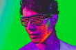 © oneinchpunch - Fashion model with fluo painting on the face - Cool handsome young man with florescent creative make-up