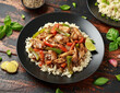 Stir fry pepper chicken with sweet peppers, onion, garlic and ginger