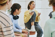 © Seventyfour - Portrait of teenage girl sharing feelings in support group circle for children