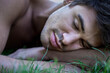 © Redzen - Young man asleep in the grass
