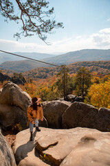 Wall Mural - woman traveler enjoying autumn view