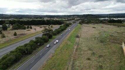 Sticker - High-angle drone footage of cars driving on the M31 freeway in the city of Wallan Australia