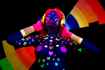 Female dancer in glow UV costume