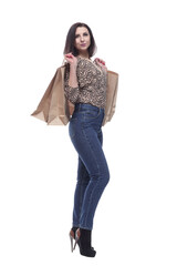 in full growth.attractive young woman with shopping bags.