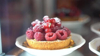 Sticker - Fresh raspberry tartlet on a plate coated with sugar in Florence, Italy