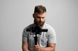 © Volodymyr - Professional filmmaker with a dslr camera on 3-axis gimbal stabilizer. Filmmaking, videography, hobby and creativity concept.