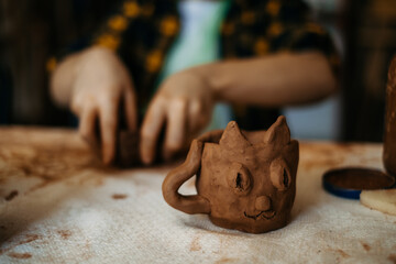 Wall Mural - children's hands sculpts clay crafts pottery school