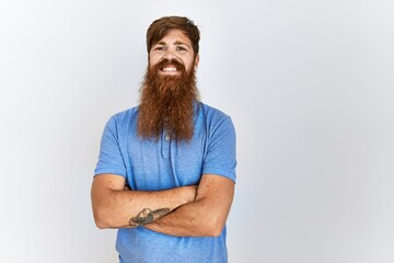 Poster - Caucasian man with long bear standing over isolated background happy face smiling with crossed arms looking at the camera. positive person.