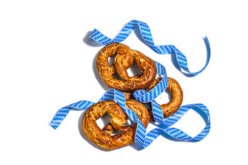 Oktoberfest concept - pretzels on a traditional napkin isolated on white background