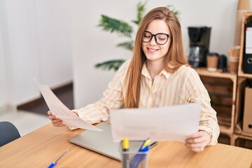 Wall Mural - Young blonde woman business worker reading document at office