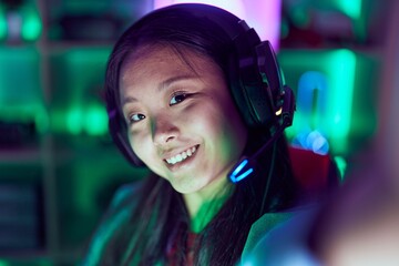 Poster - Young chinese woman streamer smiling confident make selfie by camera at gaming room