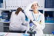 © Krakenimages.com - Blonde woman working on cruelty free laboratory stressed and frustrated with hand on head, surprised and angry face