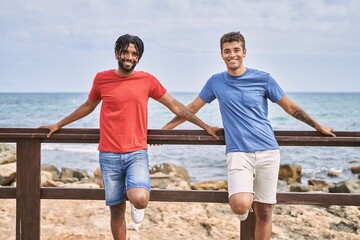 Poster - Two african american man smiling happy standing at the beach.