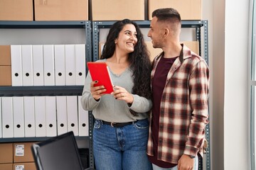 Wall Mural - Man and woman ecommerce bussines workers using touchpad working at office