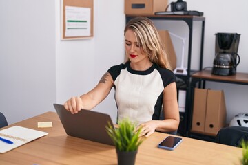 Wall Mural - Young beautiful hispanic woman business worker using laptop working at office