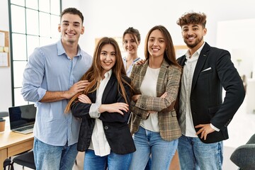 Group of young business workers smiling happy standing with arms crossed gesture at the office.