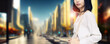 © metamorworks - woman walking in the city. Wide image for banners, advertisements.
