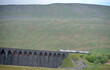 Train crossing Ribbleshead Viaduct in Yorkshire Dales