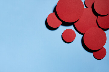 Poster - colorful abstract background with red textured circles as decorative swarm, border with copy space f