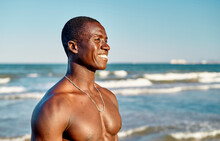 Cheerful Black Male Smiling Near Sea