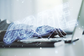 Poster - Creative Code word sign and hands typing on laptop on background, international software development concept. Multiexposure
