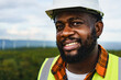 © ztony1971 - Close up portrait of black optimistic engineer man smiling to camera while working outdoor.