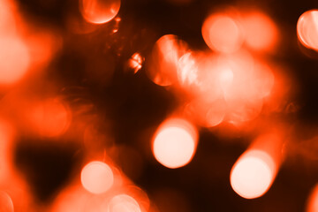 Blurred lights, dark orange background. Abstract bokeh with soft light