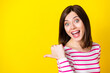 Closeup photo of young crazy attractive lady looking you directing finger empty space isolated on yellow color background