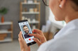 © Studio Romantic - Woman is going to give a like to man's photo in mobile dating app on smartphone screen. Single woman looking for love and relationship online. Searching for romantic partner in social app concept.