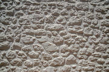 Wall Mural - Masonry house stone wall closeup as stone background