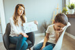 © Dragana Gordic - Woman social worker talking to boy. Child psychology, mental health. Parenthood and child development, young worried mother comforting little son crying at home.