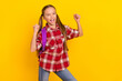 © deagreez - Photo of funny lucky schoolkid dressed plaid shirt rising fists screaming isolated yellow color background