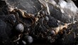 Black marble surface with bubbles and yellow veins macro