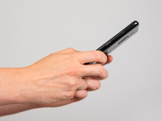 Poster - Woman hands closeup texting message at phone. Female using for instant messaging, sharing photos, videos in messengers or typing SMS. Online communication concept