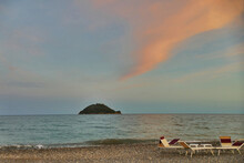 Scenic View At Sunset Of Gallinara Isle From The Beach