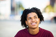 © mimagephotos - Happy man daydreaming outdoors in city