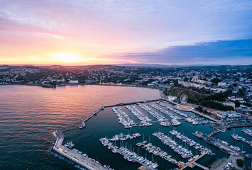 Wall Mural - Sunset over Torquay Harbour and Marina, English Riviera from a drone, Devon, England, Europe