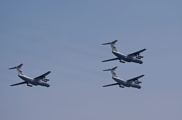 Wall Mural - MOSCOW, RUSSIA - MAY 7, 2021: Avia parade in Moscow. 3 Ilyushin Il-76 multi-purpose four-engined strategic airlifters fly in the sky on parade of Victory in World War II in Moscow, Russia