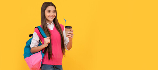 Canvas Print - happy teen school girl with backpack drink takeaway cocoa on yellow background, lunch. Banner of school girl student. Schoolgirl pupil portrait with copy space.