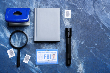 Sticker - Notebook with document of FBI agent and accessories on color background