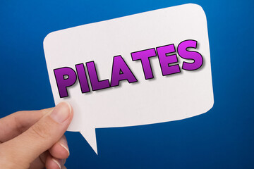Poster - Speech bubble in front of colored background with Pilates text.