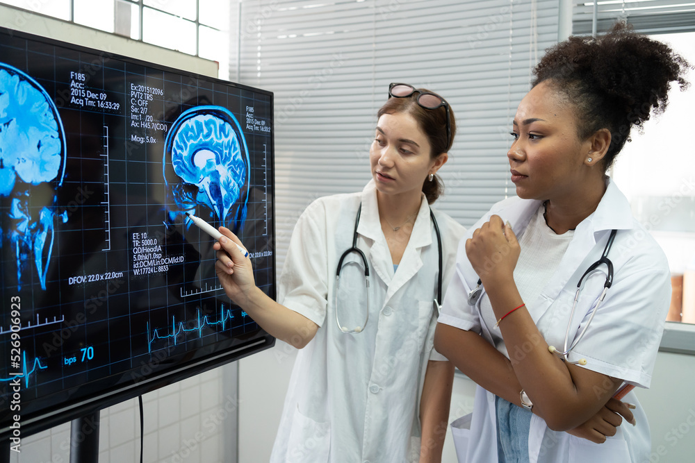 Team of medical scientists meeting in the brain research laboratory by ...
